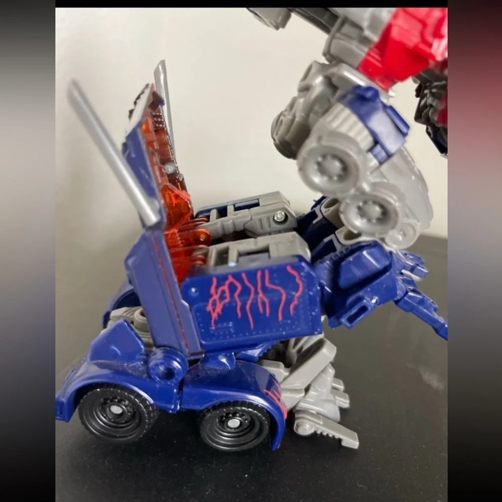 Hasbro Transforming Robot - Red, Blue, and Silver